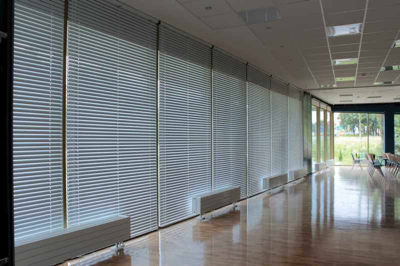 Conference room with blinds covering the windows.